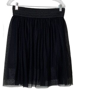 Bcx black mini skirt. Full shape with elastic waistband. Size L